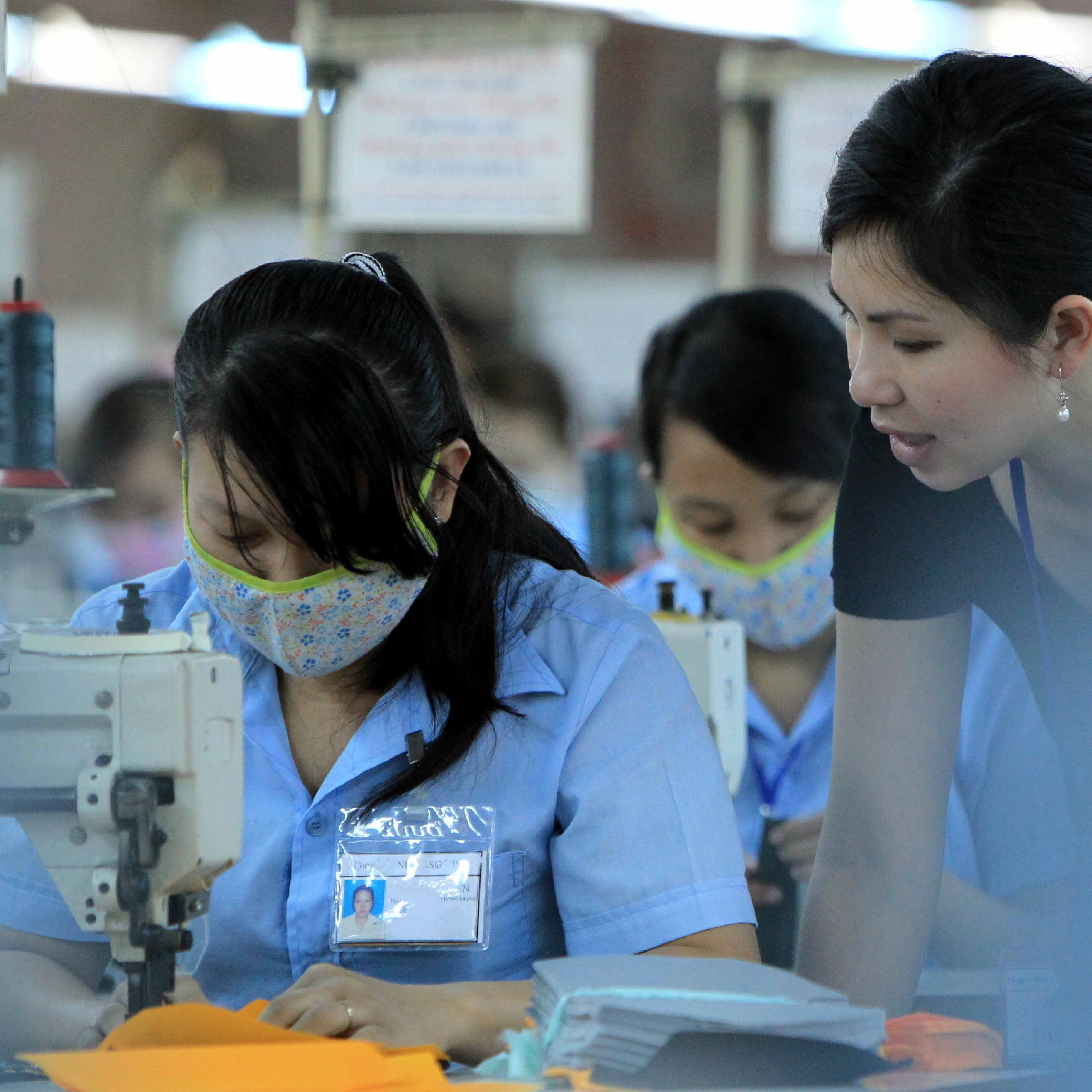 a group of women working on sewing machines